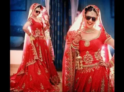 Picture of red and gold heart embroidered half lehenga and blouse 