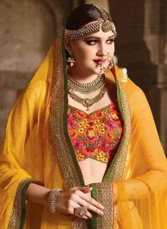 https://radhedesigner.com/images/thumbs/000/0009150_yellow-net-lehengalehenga-3000chaniya-cholicholileh_450.webp