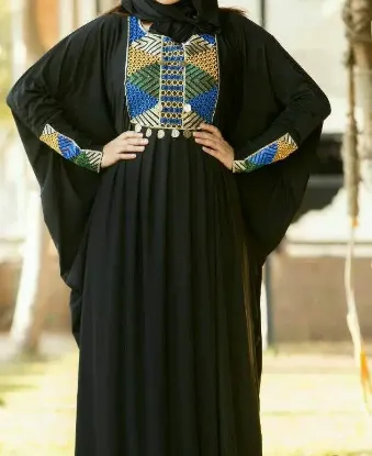 Picture of evening dress with feathers,kaftano o caftano,abaya,jil