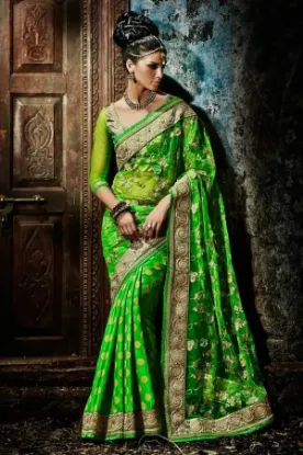 Picture of green indiandesigner saree full stone work saree grand,